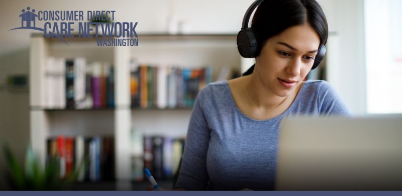 Woman wearing a headset on her computer